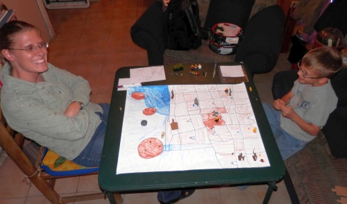 Shari and Nathanael playing a home-made board game.