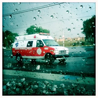 The ambulance in the rain, after picking up the two men.
