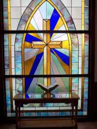 Stained glass window and Bible